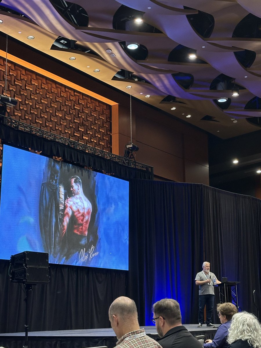 Daniel Afonso (@danieljcafonso) on Twitter photo I never nerded out so much as when I saw this Alex Ross Batman show up on the <a href="/AllThingsOpen/">All Things Open</a> screen I never nerded out so much as when I saw this Alex Ross Batman show up on the <a href="/AllThingsOpen/">All Things Open</a> screen