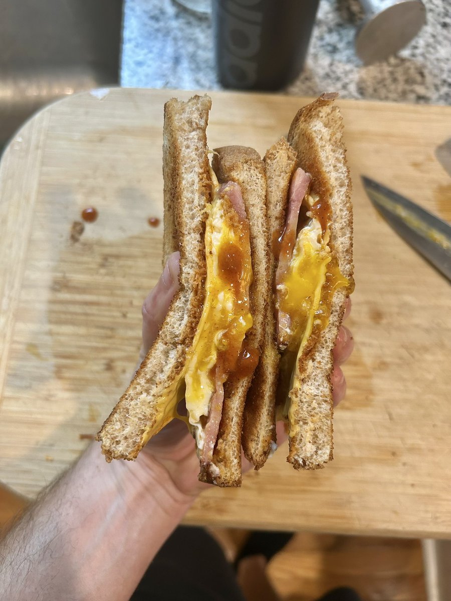 mattadler81's tweet photo. Fried egg, a slice of American, thick cut ham and a lot of Old Bay hot sauce on toasted honey wheat. https://t.co/EScrfqzYpv