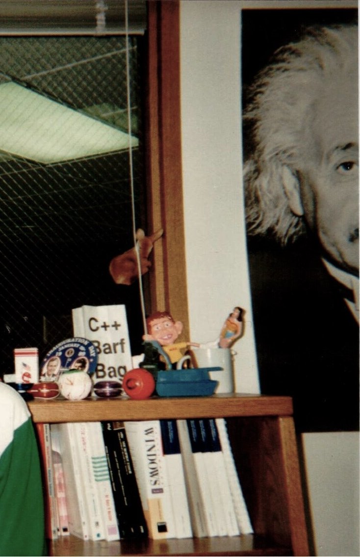stevesi's tweet image. Yay for C++. My office c. 1992. People made fun of C++ from the start hence the "Barf Bag". The blue binding set of books are from Microsoft's first C++ compiled that just shipped.