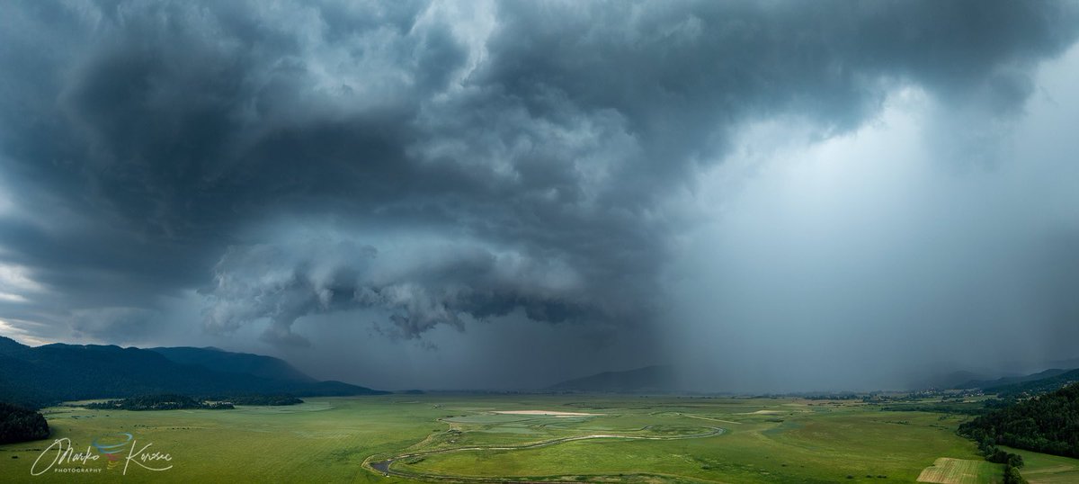 An intense supercell storm with a wall cloud rolling across Cerkniško jezero, Slovenia, on July 4th, 20225. Notice a fierce core of another storm to its right, downpouring torrential rain over Cerknica.