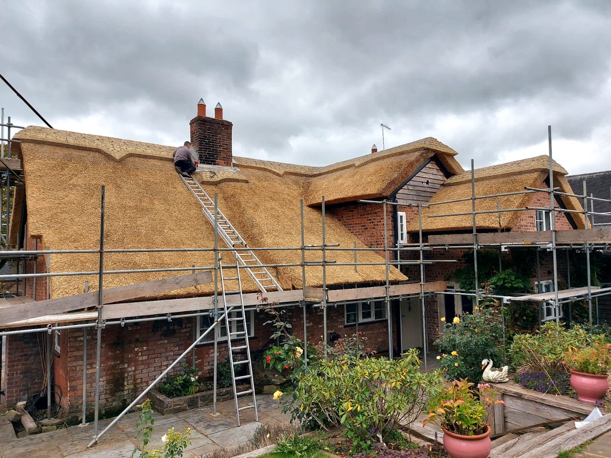 masterthatcher2's tweet image. Dave,one of our thatching team, is just completing the Lead flashing to the #chimney on our recently completed roof at #Swynnerton in #Staffordshire. Just the scaffolding to drop. This roof was thatched by Rafal,Daniel and Michal. #Thatching.