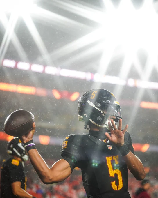Photo of Jayden Daniels on the field pregame.