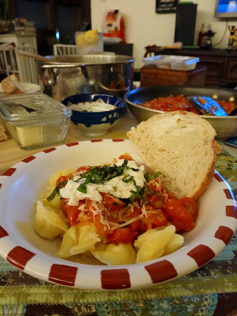 My burrata cherry tomatoes shallots garlic on a bed of tortellini dish