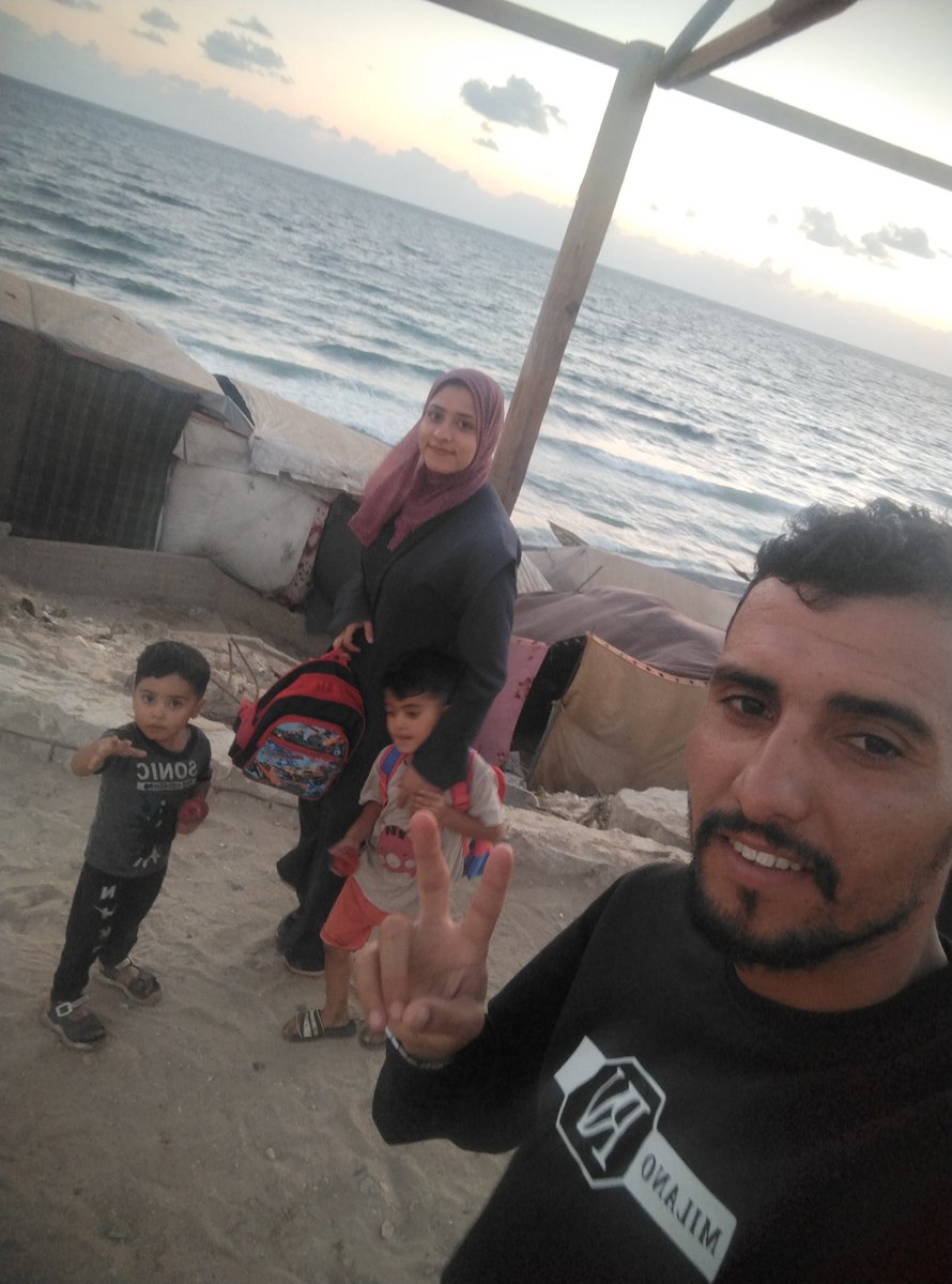 Today, my wife Yara and I, along with our children Imad and Adam, walked near the shore of Gaza’s sea🍉.
We were so happy — simply because we didn’t hear the sound of ambulances carrying the wounded, nor the echoes of bombing and explosions.
For the first time, we felt that we