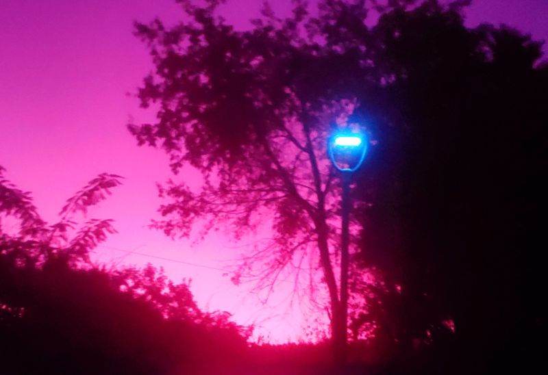 PTC3645's tweet image. That's my favorite type of photos to take because they show a stark contrast. I did one with an LED street light and a sunset in the background.
