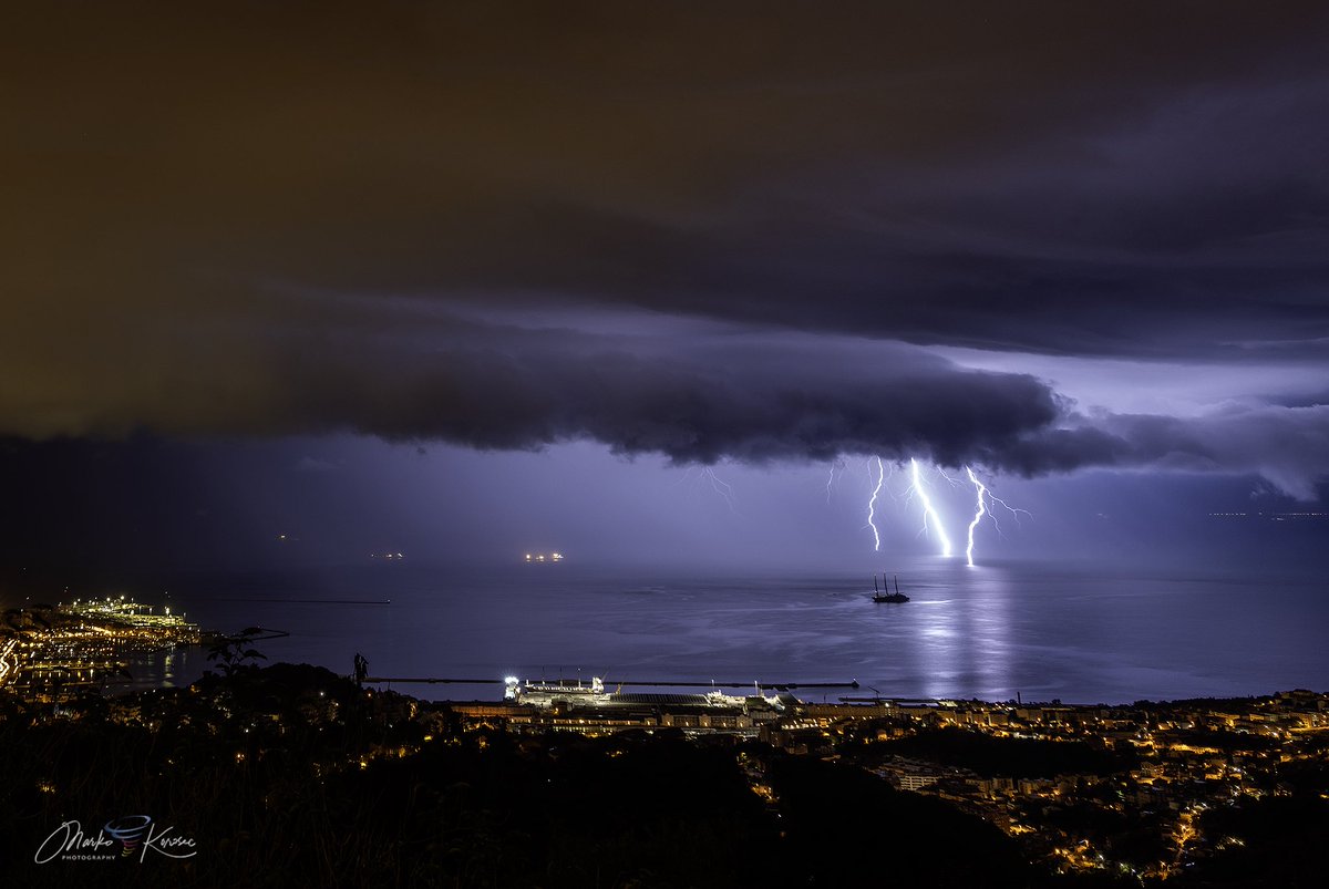 A shelf cloud with sporadic CG bolts is rolling towards Trieste, Italy, at night on September 13th, 2025.