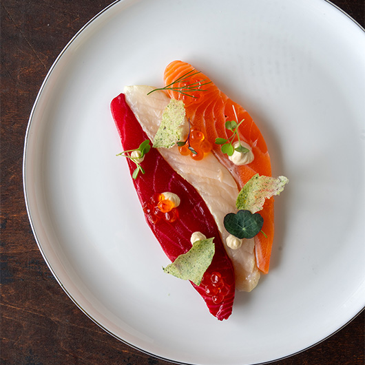 Two fish, one fine plate. 🎨 Beetroot-cured salmon and smoked haddock, united by a cloud of miso cream, roe and crunch. A little art, a lot of flavor. 🐟✨ bit.ly/4n9efQC #RecipeOfTheDay