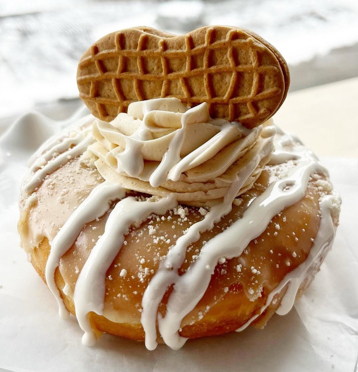 “Fill It” Friday Presents 👇🏼 { Fri 10/17 } 
Nutter Butter Explosion 💥 🔥  
This is a Peanut butter Dream ~  
Our yeast shell fulled with and topped  peanut butter buttercream, drizzled with marshmallow glaze. Then topped with a nutter butter cookie.  Shit the front door!!