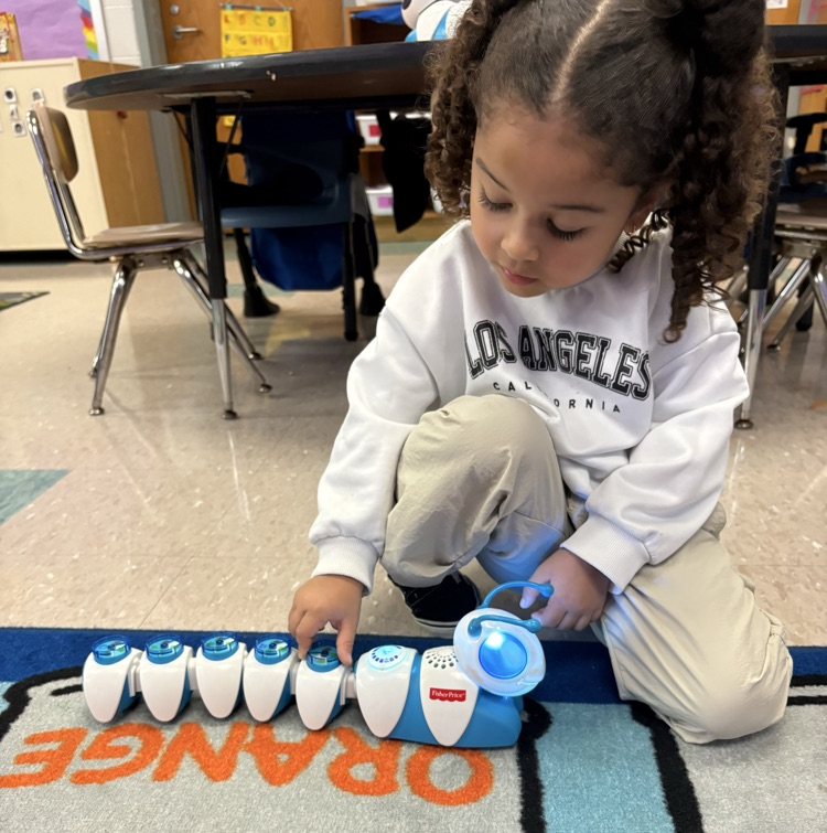 DCEsuperhornets's tweet photo. Mrs. Hubbard's class became mini programmers! They helped our Code-a-Pillars wiggle and crawl their way to find the letters E and F. The kids had to think critically, make a plan, and work together as a team to get their caterpillars moving! #LaunchintoLearning https://t.co/D3v6mPHbze