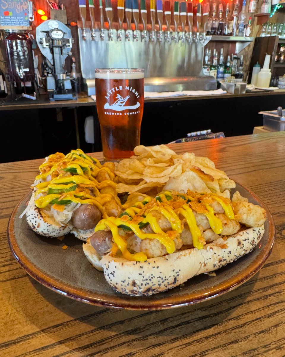 Treat yourself to our Wednesday Surprise Sandwich!

The Dirty Joe — two beer soaked brats in everything but the bagel buns, sauerkraut, tater tots, jalapeños, mustard, and sprinkled with crushed chili cheese Fritos, and served with kettle chips!

Available to order at the bar