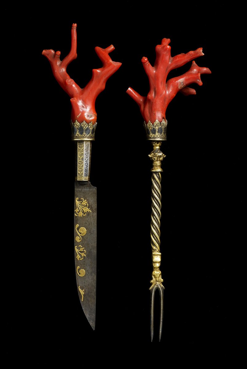 A Renaissance cutlery set consisting of a knife and a fork. The handles are made of red coral, which was believed to be an antidote to poison during that time. The set is an ultra-rare example of Italian craftsmanship from the late 1500s.