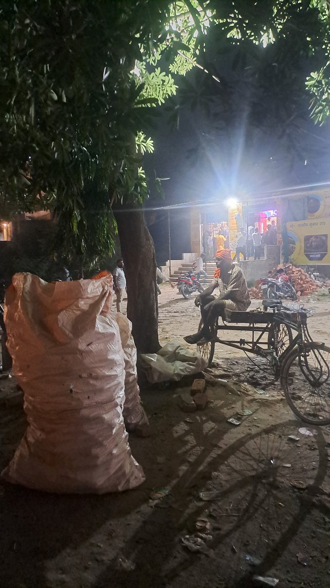 Benarasiyaa's tweet image. A man sitting outside a liquor outlet guarding his "prized possession"-two sacks of empty beer cans he managed to collect since 10 am in the morning. That's his everyday ritual he makes a living out of.
Photograph taken in Varanasi,UP.