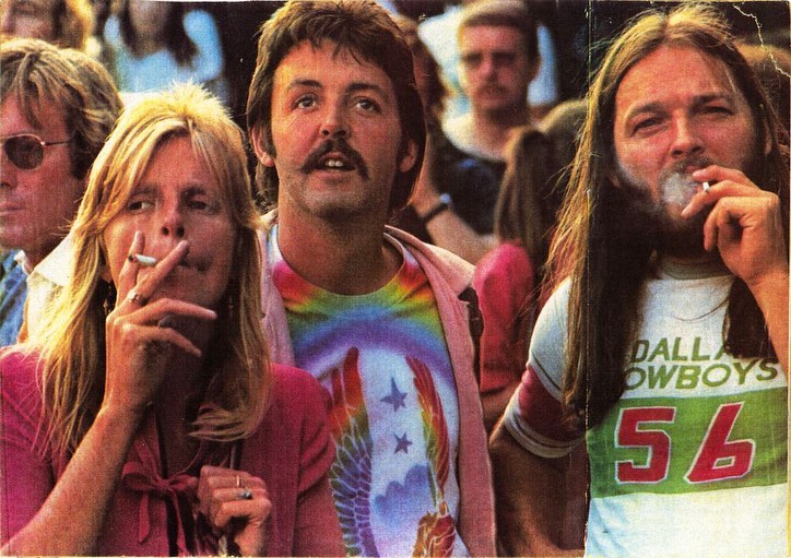 Linda and Paul McCartney with Pink Floyd’s David Gilmour at Knebworth Festival on August 21, 1976.