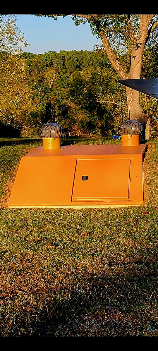 wrmay's tweet photo. This project has been successfully concluded. EF10 proof 11,000 pound concrete storm shelter installed. Tornado Alley has shifted our way. The color is Sherwin-Williams high gloss "Laughing Orange"  It is visible from aircraft flying 30,000 feet or more above it. Our grandkiddos love it