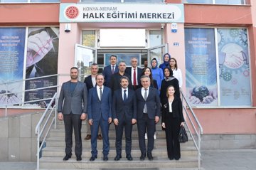 First image shows a yellow building facade with Olgunlasma Enstitusu Konya sign and logo, featuring a group of four people standing outside including women in dresses holding bouquets and men in suits. Second image depicts a pink building entrance with Konya Meram Halk Egitimi Merkezi sign and logo, showing a large group of about 15 people in professional attire posing on steps in front of the building with banners. Third image displays a blue industrial sewing machine in an indoor setting with several people in suits and dresses observing it closely. Fourth image portrays an indoor room with wooden ceiling and table covered in fabrics, yarns, crafts, and books, surrounded by a group of people including women in headscarves and men in suits engaged in activities.