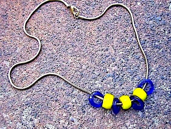threepeats's tweet photo. Come With Me Now #necklace $24.00  https://t.co/JRNjHwZJXH #handmade using #recycled #vintage slnky, goldtone metal snake chain &amp; clasp with free-sliding bright blue &amp; yellow glass beads #EcoFriendly #unique #urban #chic #giftideas #etsyfinds https://t.co/GK9Fvql8PH