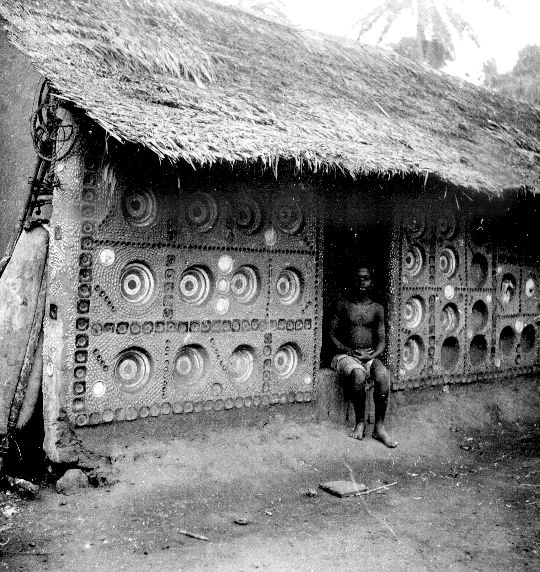 Interior of a house with plates embedded in the walls, South Ikwerre. Photographed by G. I. Jones in the 1930s.