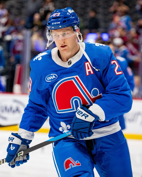 Nathan MacKinnon on ice in a Nordiques uniform.