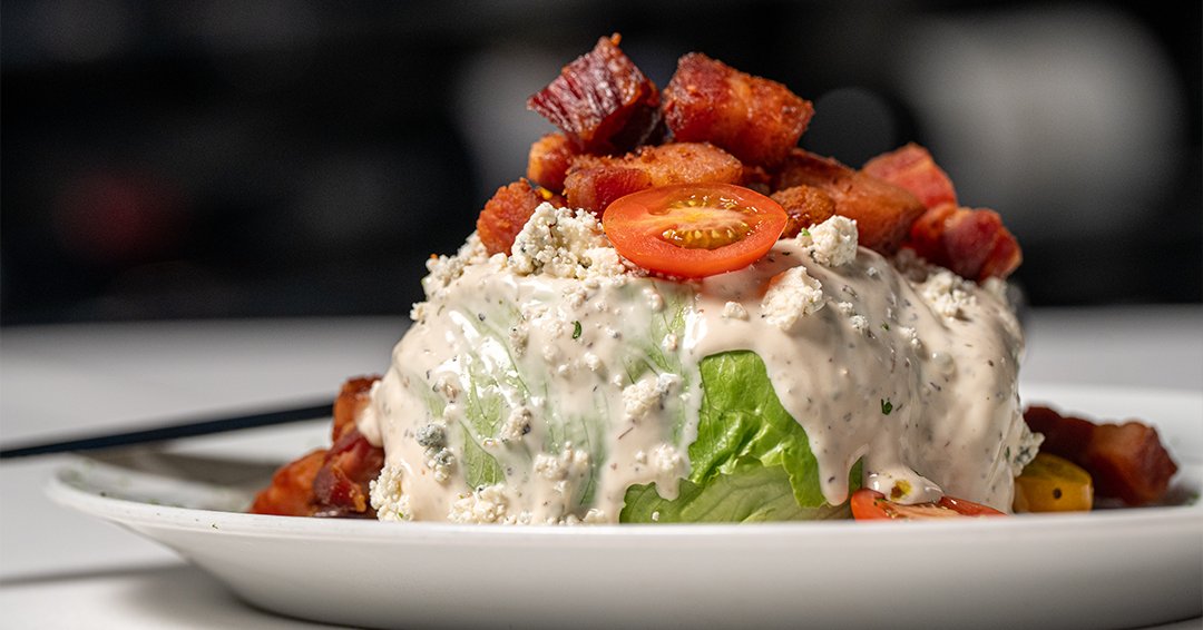 Crisp, cool, and decadent — our Steak Knife BLT Wedge features a baby iceberg head, creamy Shaft’s blue cheese, smoky bacon lardons, and sweet heirloom cherry tomatoes. Bold flavors with a fresh finish.

#domsteak #steakhouse