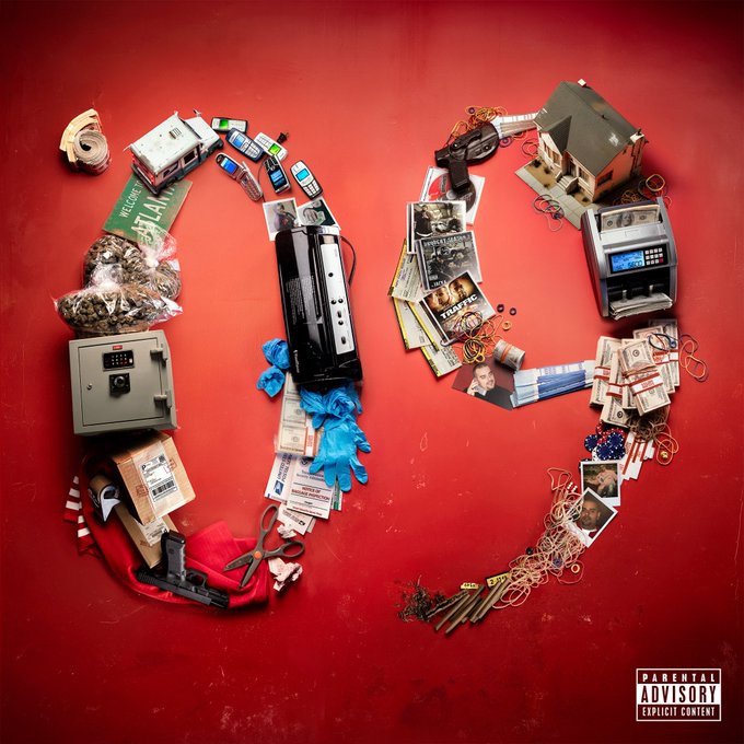 Red background with objects arranged to form large number 09 including toy house, cash stacks, gun, cassette tape, documents, plastic bags, stapler, phone, safe, gloves, scissors, and paper clips all in artistic collage style.