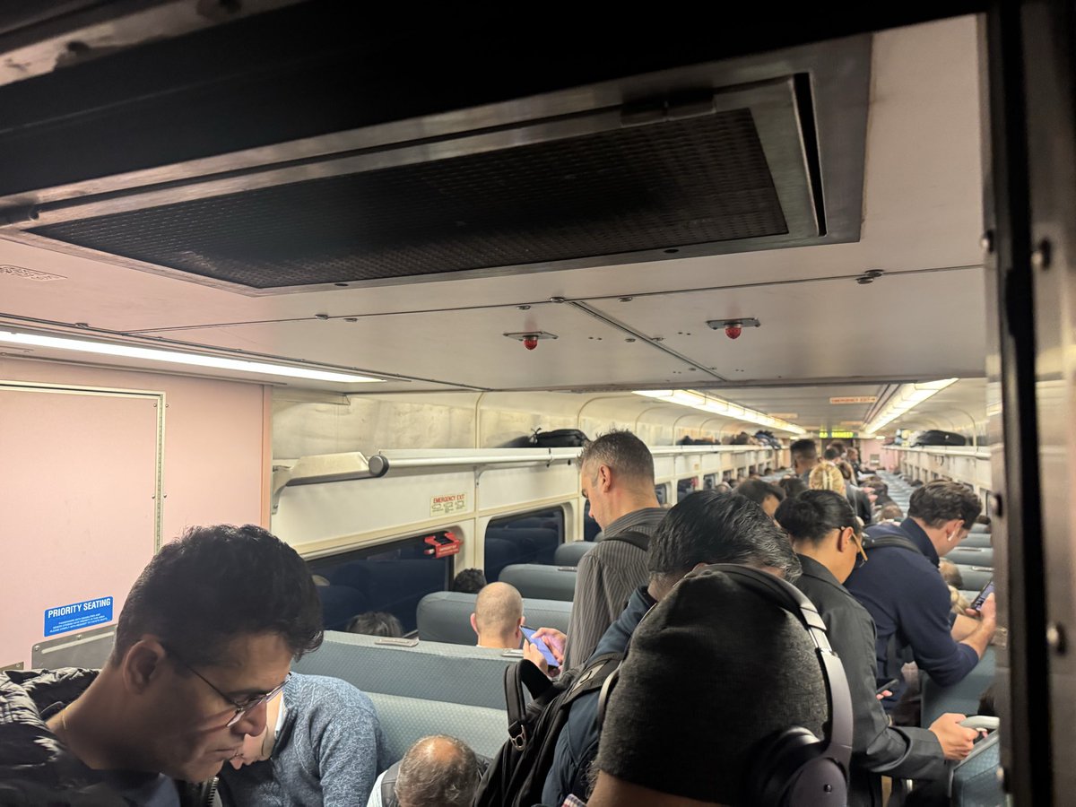 NickDicos's tweet photo. What’s the 3% annual NJ Transit fare hike really for? Surely not trains that can fit all passengers on a normal Tuesday night! 🚆😡 Live view of the overcrowded 6:21 from Newark. When will this get fixed? Probably not under this admin. Fingers crossed for the next gov. https://t.co/SStl6xOQQj