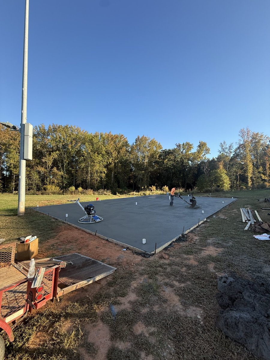 Concrete pad is poured. Batting cage is on its way.