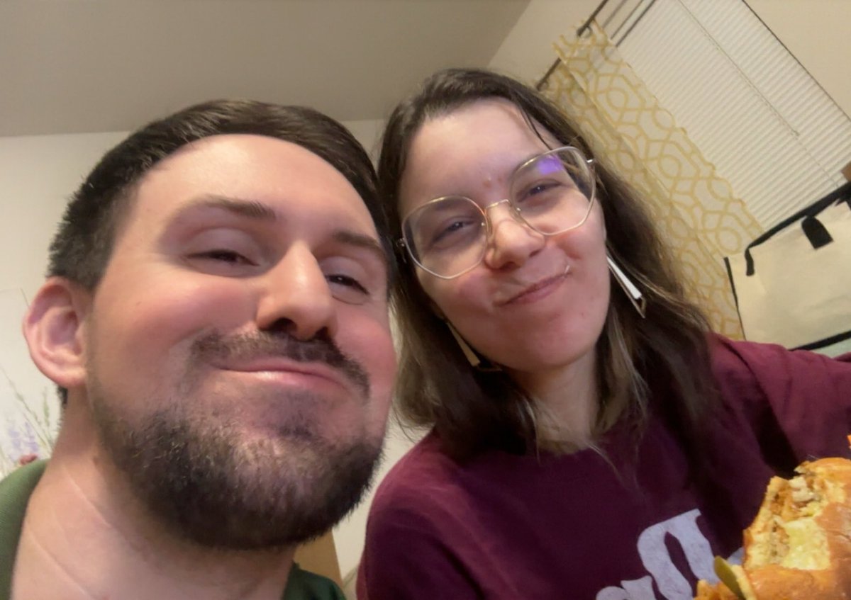 Face of a mfer with a Popeyes sandwich and a switch 2