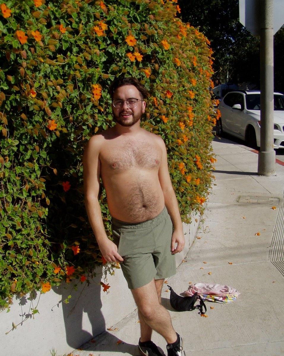 claire0voyant's tweet photo. had to rip my shirt off in front of the orange flowers https://t.co/nQquZXsfcu