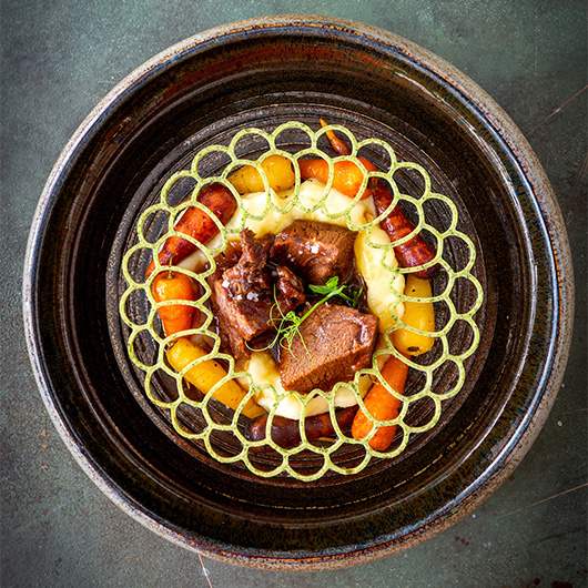 Tender veal cheeks in brown beer jus with Liège syrup &amp; gingerbread, creamy mash, rainbow carrots and a crisp herb tuile on top. Pressure-cooked perfection: big flavors, zero waiting! bit.ly/4qgJXye #RecipeOfTheDay