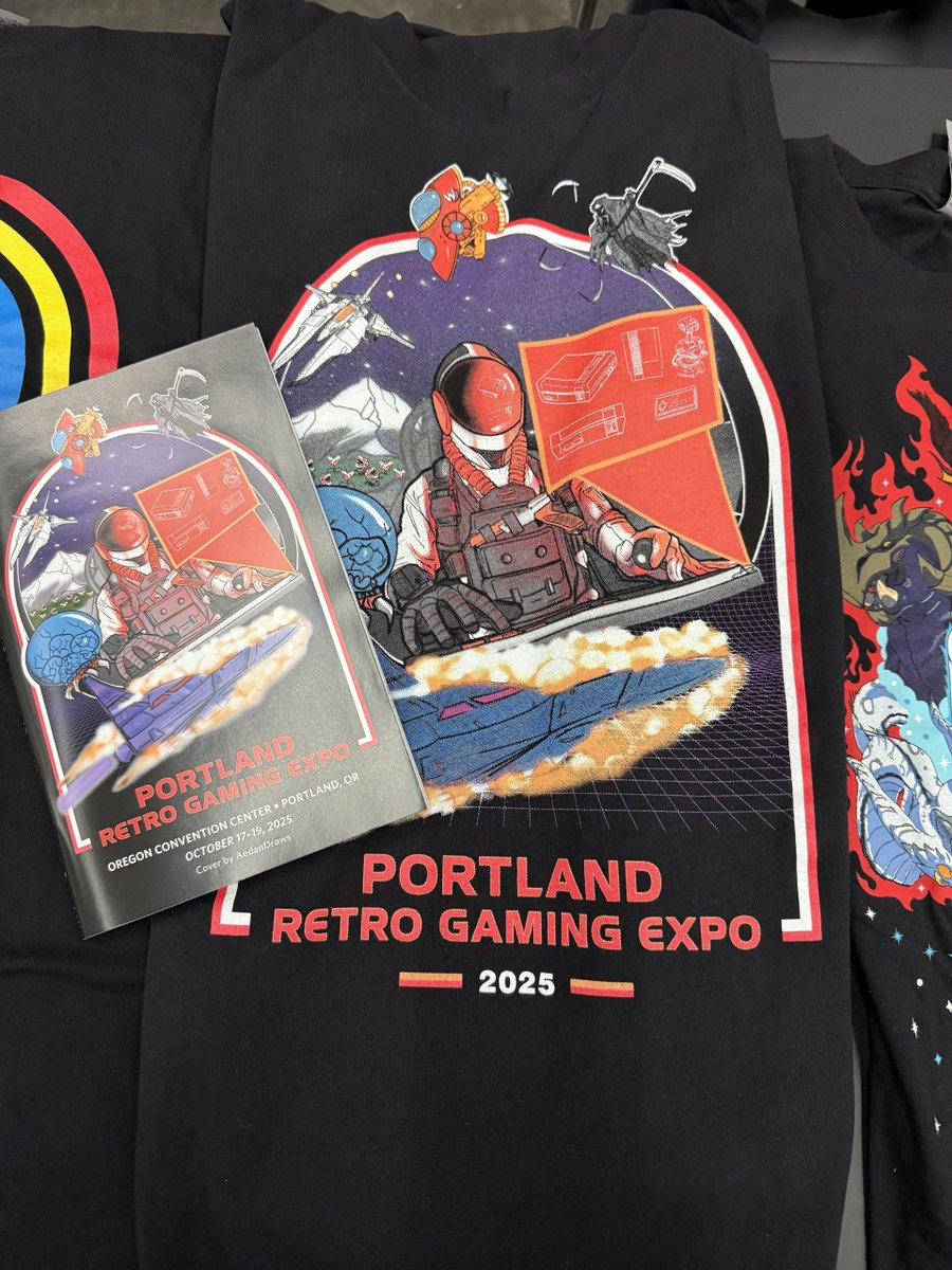 RetroGamingExpo's tweet image. Best Of PRGE 2025 part 5: Here is our design for this year, get your t-shirt at the show! And time travel back to the late 1970s, early 1980s in our retro living room. tinyurl.com/3km56wbt
#prge #prge2025 #retrogaming