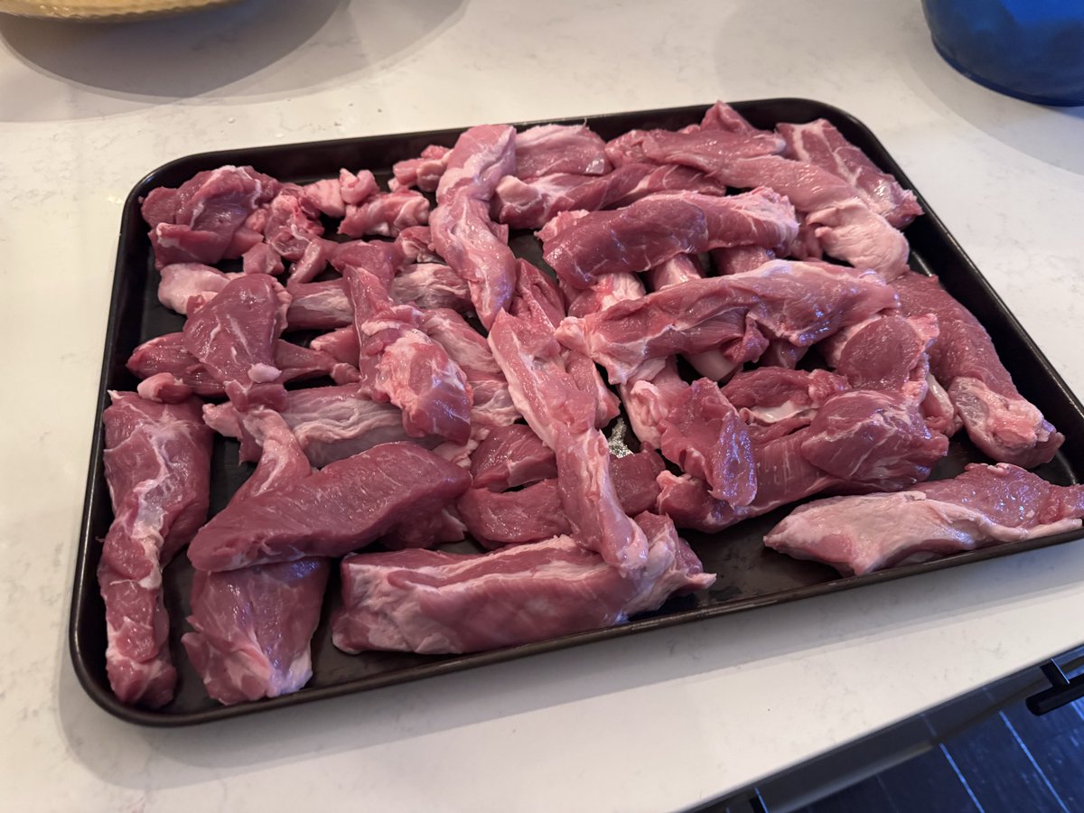BaconGuRoux's tweet photo. Busy busy morning getting some pork butts sliced up so I can make some tocino and longgonisa while my wife (asawa) will use the other half to make lumpia and pancit.
#FilipinoFood #Kalami #Masarap https://t.co/9t960lJY4Z