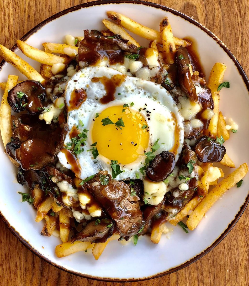 The French Dip Poutine. Crispy fries. Angus beef. Melty curds. Sunny eggs. Total bliss—served daily.