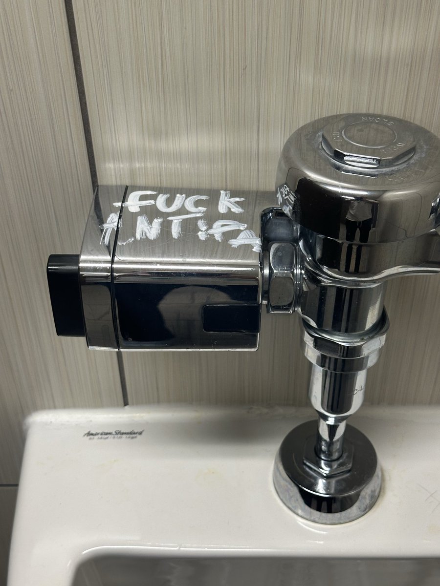 Graffiti in a restroom in a King Soopers in deep blue Denver: