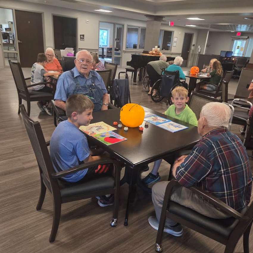 Mrs. Raymond's third graders read to the Legacy Square residents yesterday. 📚 We are very fortunate that our students can walk across the street for visits! #heartlandhuskies