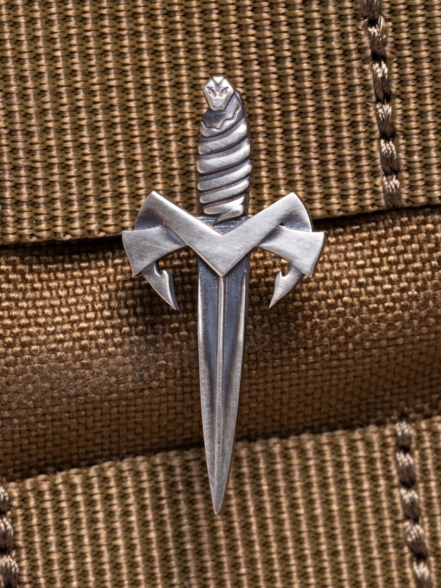 Frost, yourselves. 

Elevate your style with a striking dagger lapel pin in sterling silver or 18k gold.

A collectible emblem of precision, strength, and sophistication. Wear it honorably. 

#MicrotechKnives #LuxuryAccessories #TacticalFashion #StatementPiece #CollectiblePin