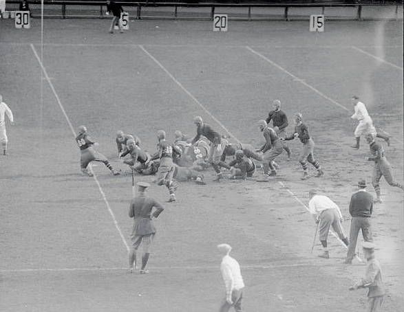 Oct. 17, 1925: Army’s football team wins a crushing upset over Notre Dame, 27-0, at Yankee Stadium in New York. West Point’s fullback “Lighthouse Harry” Wilson is seen crashing through the Irish line in a game where he scores a touchdown. 1/2