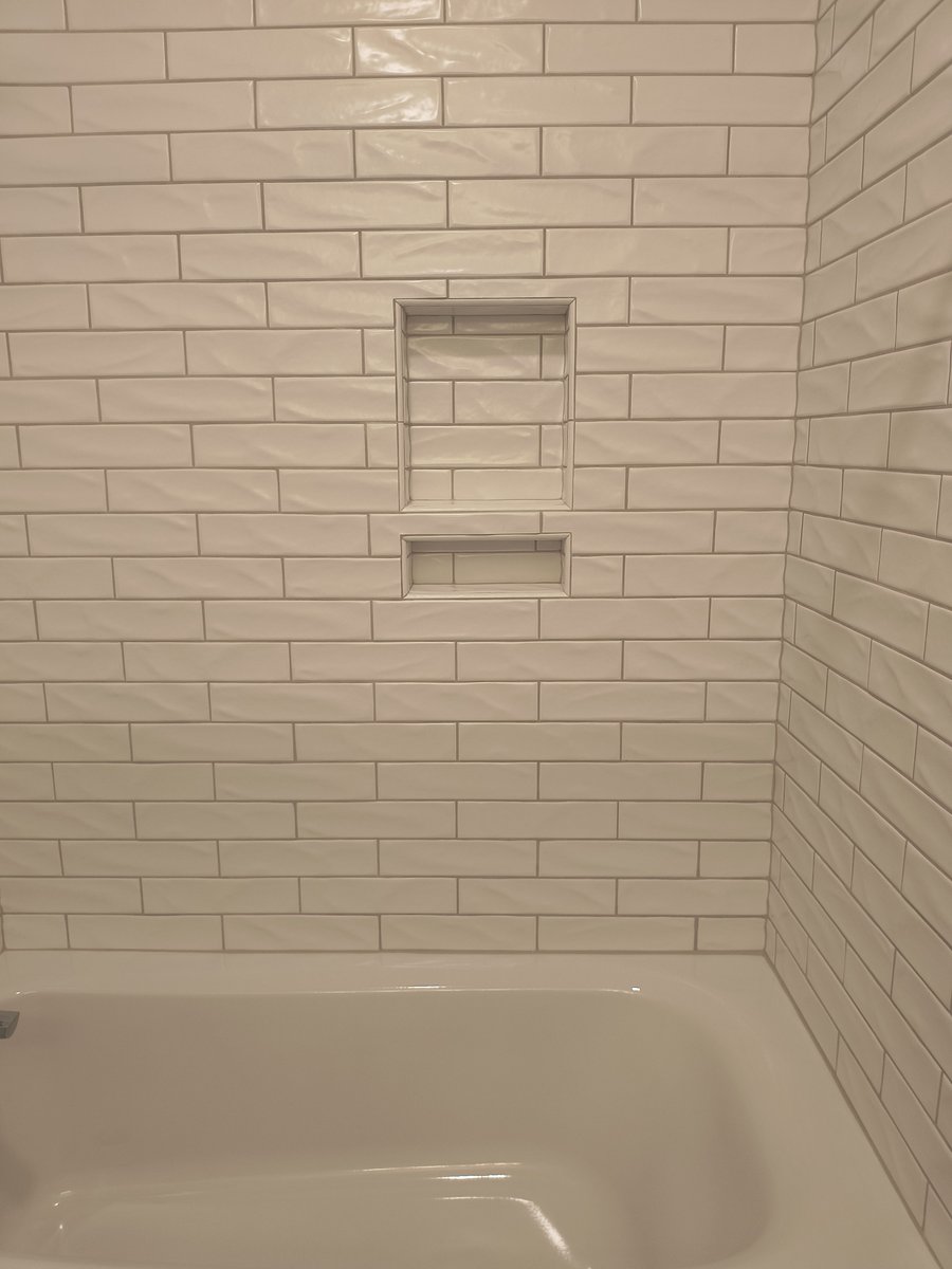 SolidStateTile's tweet photo. Fresh, clean, and timeless. This bathroom got a full refresh with glossy subway tile, dark slate-style floors, and crisp white finishes that make every detail pop.

#tile #tilefloor #tileshower #tilebathroom #bathroomreno #bathroom #winstonsalem https://t.co/FMEoGEBOEj