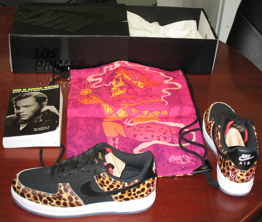 Black/white gingham Lipson button-up; heathered tan socks; tan Tommy Bahama shorts; Swarovski crystal Bulova watch; black/white Torino belt; Kona coffee (stained literally) Hawaiian (from Hawaii) undershirt; Michael Jordan cologne to smell like Mike.