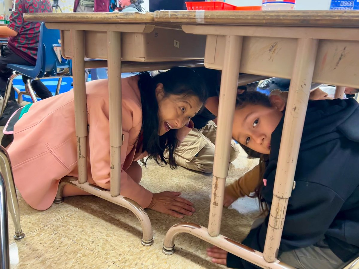 SFUnified's tweet photo. Drop, cover and hold! Today on the anniversary of the 1989 Loma Prieta earthquake we practiced what to do during an earthquake with our city partners at Guadalupe Elementary. https://t.co/ELFTFulyOd