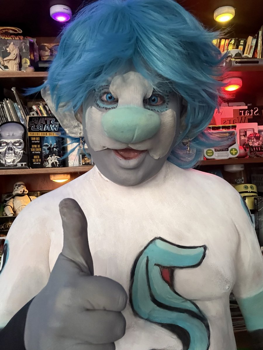 goldeneye545's tweet photo. I had a great time creating this character  Bouy the mascot for the @SeattleKraken . He was done for a viewer sparky pickle. Bouy came to life thanks to @NorthFurFX  awesome beaver prosthetic and cartoon nose.  #seattlekraken #krakenmascot #hockey #northfurfx  #bodypaint https://t.co/IV1YqMmT2p
