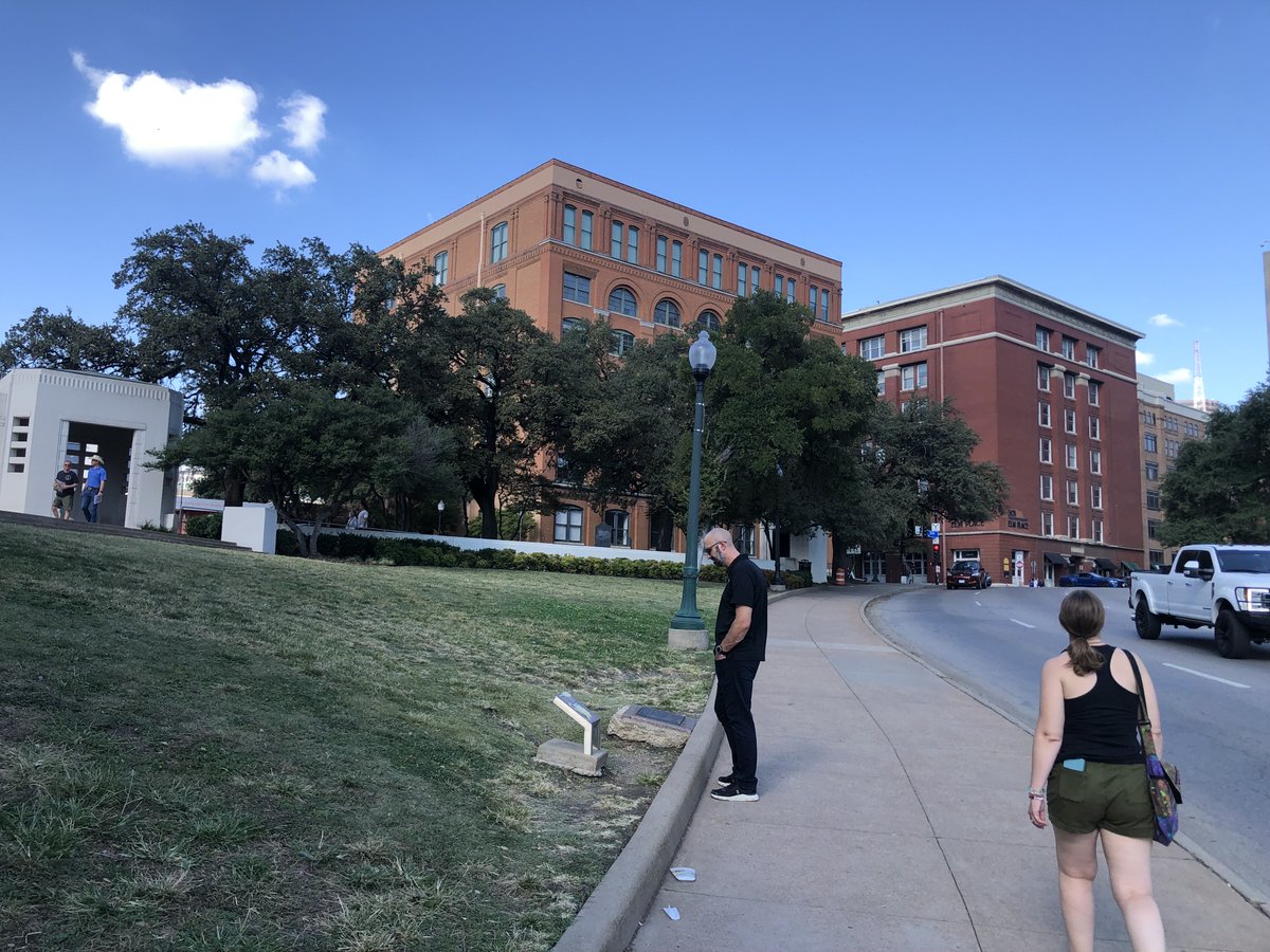 Grassy knoll and book depository where Oswald fired the fatal shot