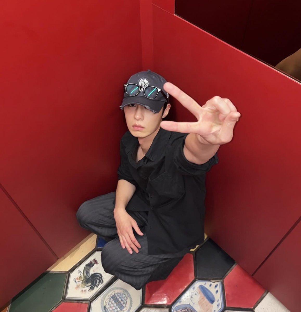 Somewhere between shadows and red walls.