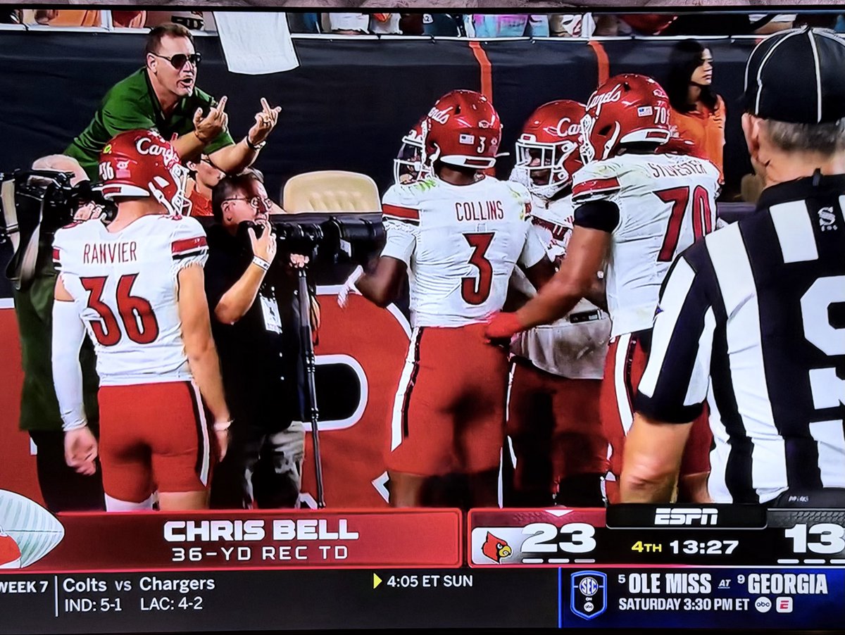 plexander's tweet image. Early in the 4th, Louisville scores and a Miami fan is very displeased.  Two birds fully visible on national TV (ESPN).