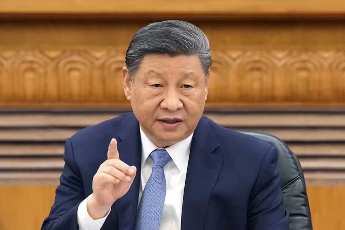First image depicts Xi Jinping a Chinese leader with short gray hair wearing a dark blue suit white shirt and blue tie seated in a wooden chair gesturing with his right hand index finger extended while facing forward in a formal setting with wooden paneling behind. Second image shows Ursula von der Leyen a European politician with short blonde hair wearing a light green blazer and white top standing at a podium with two microphones in front of a blue background featuring yellow stars representing the European Union flag her expression serious as she speaks.