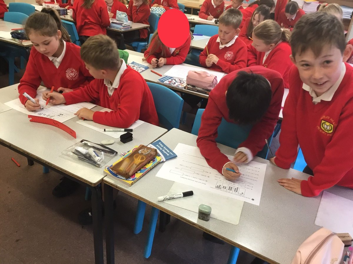 Class 12 loved working as maths buddies today to support and help each to solve missing number problems. BIG paper = BIG thoughts!