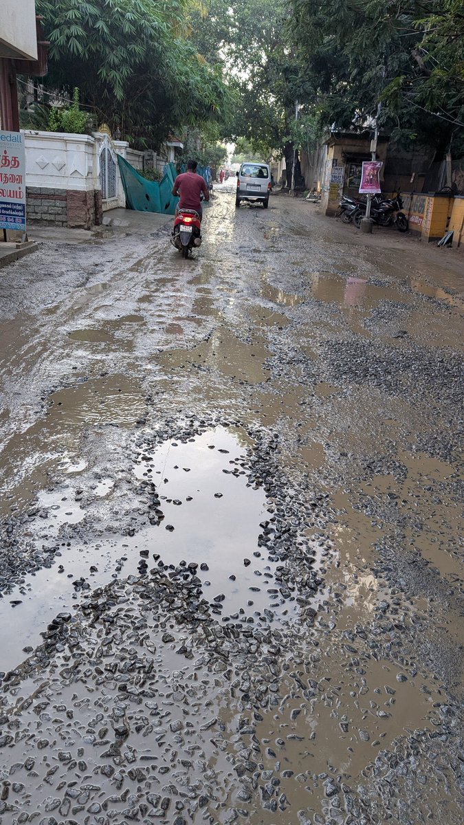 ActorVijayTeam's tweet image. Terrible road condition in Thoraipakkam. Large potholes and waterlogging making travel unsafe. Urgent repair needed @chennaicorp