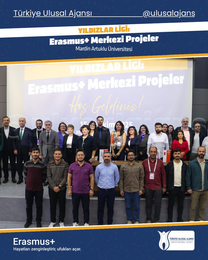 Group of professionals including men and women in business attire standing on stairs in front of a university building with blue banners reading YILDIZLAR LIGI and Erasmus+ Merkezi Projeler hosted by Mardin Artuklu University visible in the background along with Turkish flag elements and event signage