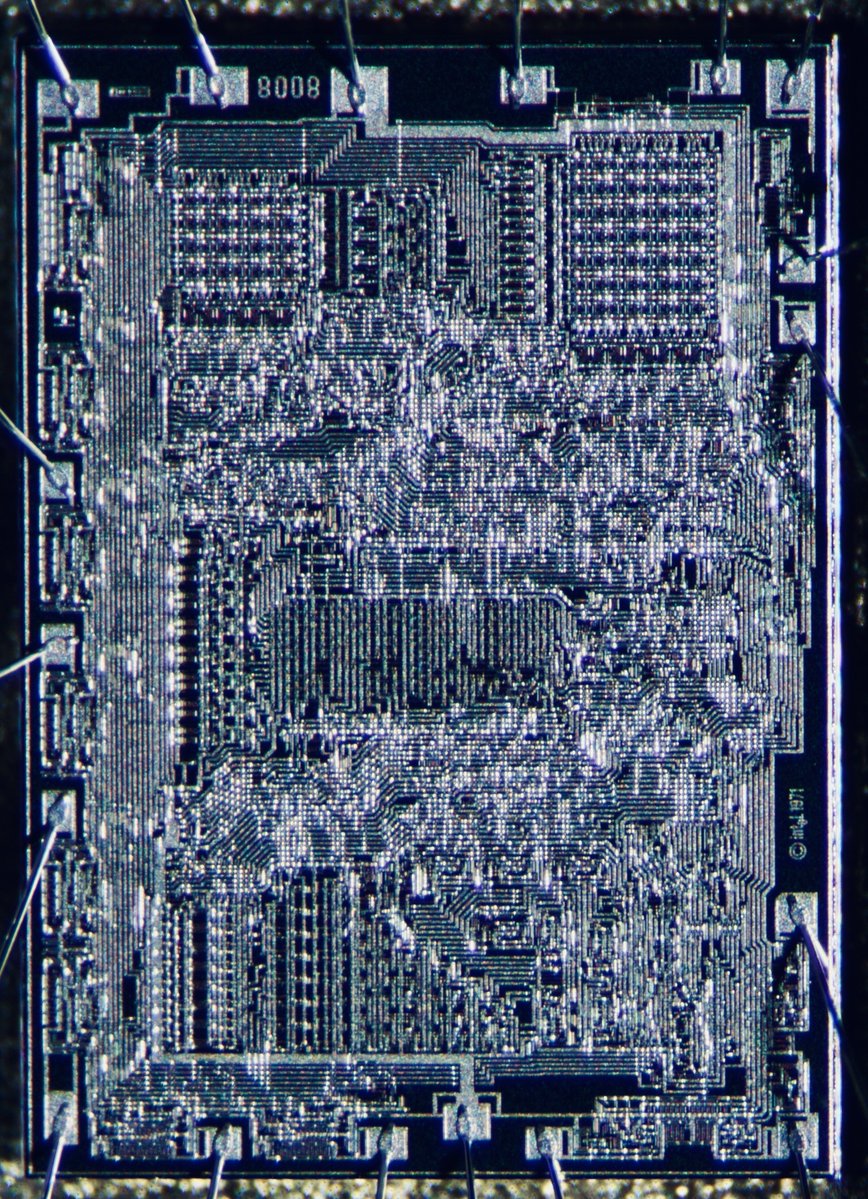 duke_cpu's tweet image. It’s #Intel‘s first 8bit microprocessor!
Next, I go closer using my Wild/Leica stereomicroscope with phototube. As the light comes from the side, the image is high in contrast due to reflections on the top metal layer. But there is much more below the surface…
(4/n)