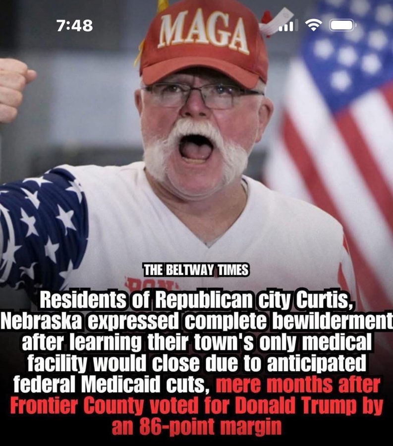 Elderly man with white beard and glasses wears red MAGA hat, white shirt, and arm sling, mouth open in surprise, raising arms, American flag in background. Text overlay reads The Beltway Times with article about Curtis Nebraska residents bewilderment over medical facility closure due to federal cuts after voting for Donald Trump by 86-point margin.