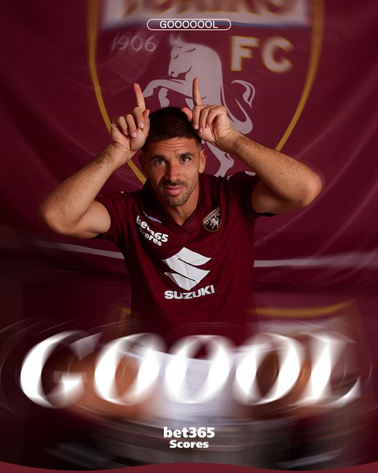 A male soccer player with short dark hair and a beard stands celebrating with both hands raised making a horn sign gesture near his head. He wears a maroon Torino FC jersey with Suzuki sponsor logo and club emblem on the chest. Behind him is a large yellow and maroon banner displaying the Torino FC logo featuring a bull and the year 1906. Bold white text GOOOOOOL overlays the image multiple times. At the bottom, bet365 Scores text appears in white.